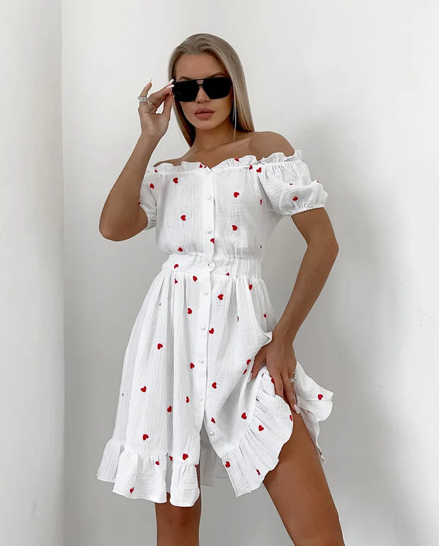 Amore - Hochtailliertes Kleid mit Puffärmeln und Herzmotiv