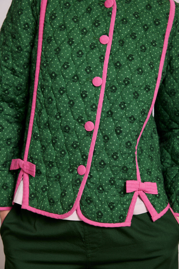 Steppjacke mit Blumenmuster und rosa Schleifen